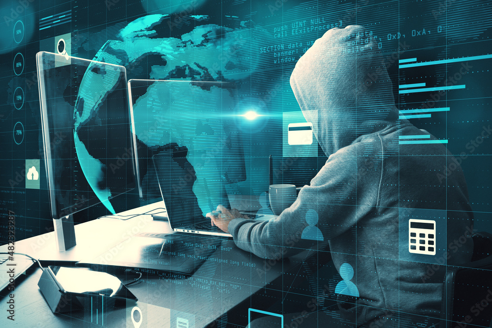 Poster Hacker at desk with monitors using laptop with creative glowing globe hologram grid interface on blurry background. Digital transformation, hacking, innovation and future concept. Double exposure.