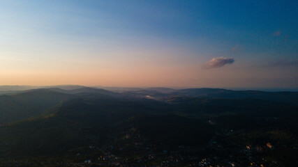 Fototapeta premium Mountains forest at sunset top view