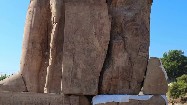 The Colossi of Memnon, two stone massive statues of the Pharaoh Amenhotep III, who reigned in Egypt during the Dynasty XVIII.