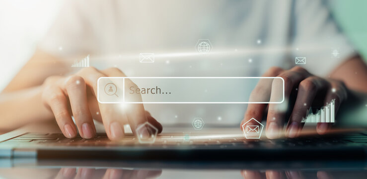 Hand using laptop and press screen to search Browsing on the Internet online.