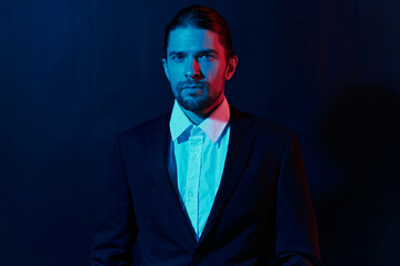 Fototapeta premium handsome man in costume posing fashion neon light