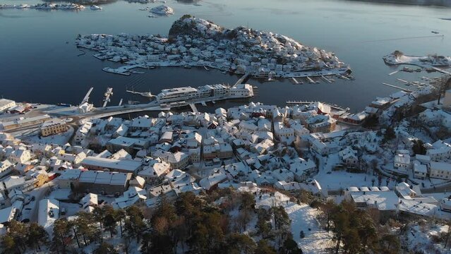 Aerial View Of Snowy Neighborhood And Oya Island At Winter In Kragero, Vestfold og Telemark County, Norway. - tilt up