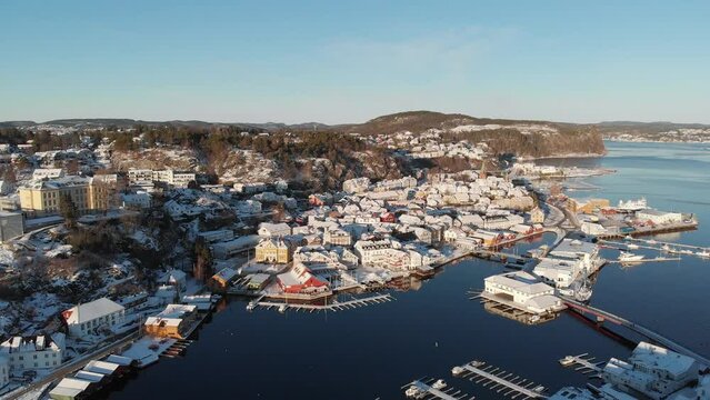 Sun Shining Over Beautiful Town And Municipality Of Kragero At Winter In Vestfold og Telemark County, Norway. - aerial ascend