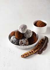 Carob energy balls with nuts, dates and coconut, vegan and vegetarian sweet food