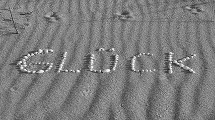 with shells laid symbol happiness on the beach of the Baltic Sea in the sand