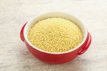 Raw couscous in the bowl
