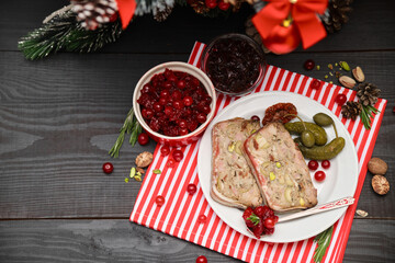 Portion of Traditional French terrine covered with bacon and decorated Christmas tree