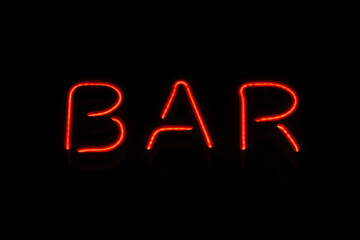 Retro neon sign with the word bar. Vintage electric symbol. Burning a pointer to a black wall in a club, bar or cafe. Design element for ad, signs, posters, banners