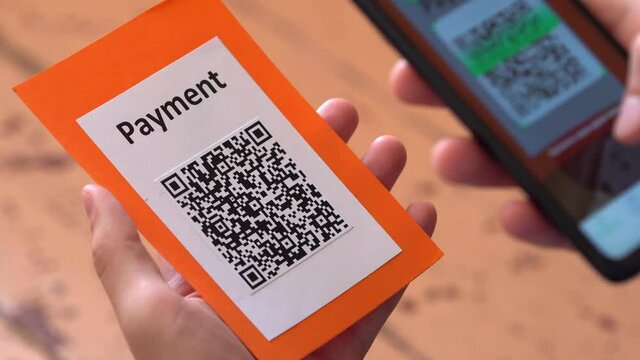 QR code payment in the restaurant. Contactless payment method where payment is performed by scanning a QR code from a mobile app