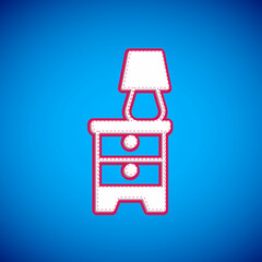 White Furniture nightstand with lamp icon isolated on blue background. Vector