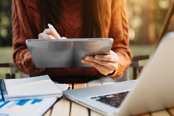 businesswoman hand working with new modern computer and writing on the notepad strategy diagram