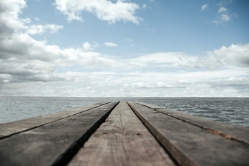 Fototapeta na wymiar Beautiful wooden pier near the river bank