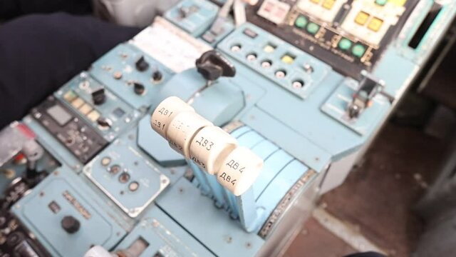 Four thrust control levers for the engines of the Russian strategic missile carrier Tu-160. Bomber cockpit. Museum exhibit. Full hd.120 fps