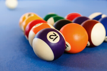 Cropped view of racked pool balls on a pool table. Close up view, selected focus