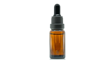 Close-up image of brown glass bottle dropper bottle. isolated dropper bottle on white background. Black color dropper cap with cleared-glass brown color. Blank space on the front for label design.