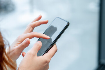 Businesswoman using mobile phone in office