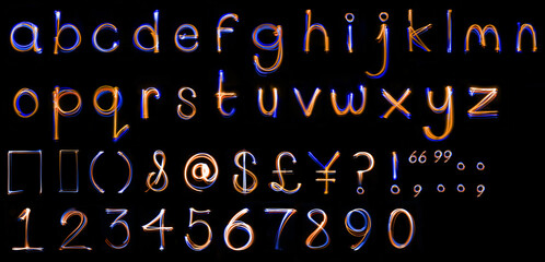 Long exposure, light drawn, lowercase alphabet.