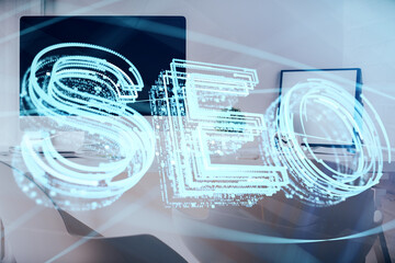 Double exposure of SEO drawing and office interior background. Concept of Search optimization...