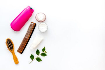 Hair care products with brush flat lay, top view