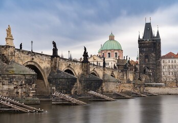 Charles bridge in Prague, Czechia. Architecture and landmark of Prague. Long exposure.