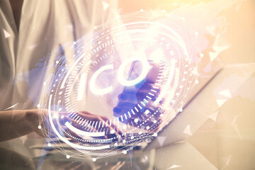 Double exposure of blockchain business sketch hologram and woman holding and using a mobile device.