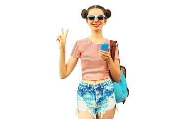 Portrait of happy smiling young woman with smartphone wearing a backpack isolated on white background