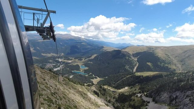 Traveling with a gondola lift in La Molina, Barcelona, Spain