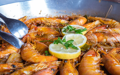 King prawns cooked in an iron skillet