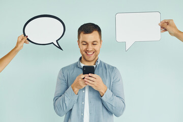 Smart person. Man standing in the studio with empty signs for the text
