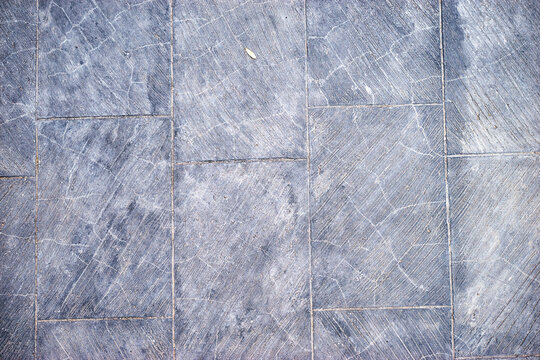 Grey tile textured background.