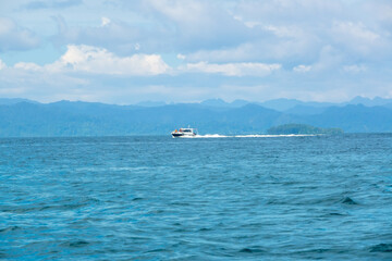Motor Yacht Sails Fast Near a Tropical Island