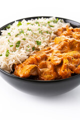 Indian butter chicken in black bowl isolated on white background. Close up
