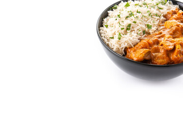 Indian butter chicken in black bowl isolated on white background. Copy space