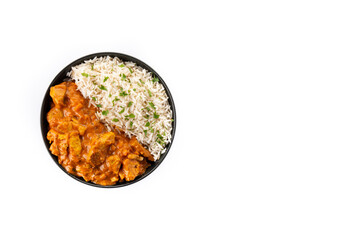 Indian butter chicken in black bowl isolated on white background. Top view. Copy space