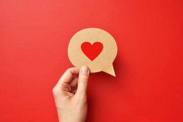 Red paper heart on a conversational cloud. Symbol of love and conversation and declaration of love
 - obrazy, fototapety, plakaty