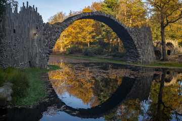 Bridge in rhododendron park in Kromlau in a beautiful autumn mood