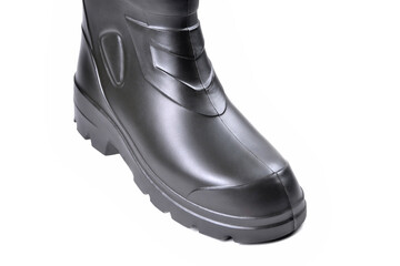 Off-road rubber boots, specialized footwear for fishing, hunting, work. Protective insulated footwear for winter and low temperatures. Polymer footwear. White background, close-up