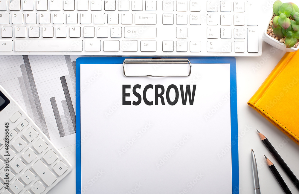 Poster ESCROW written on the paper with keyboard, chart, calculator and notebook