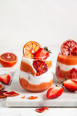 Layered trifle dessert with blood oranges cream Kurd.
