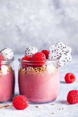 Smoothie with raspberries, banana, pitahaya, quinoa and almond milk.