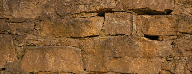 Old castle stone wall texture background. Stone wall as a background or texture. Part of a stone wall, for background or texture.