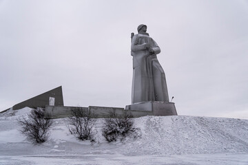 Attractions of the town. View of Monument to the Defenders of the Arctic the main symbol of the town on short winter day.