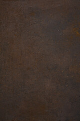 Dark Iron cast iron sheet with patina and rust. Brown and black metallic texture. 