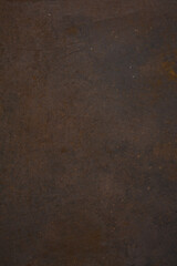 Dark Iron cast iron sheet with patina and rust. Brown and black metallic texture. 