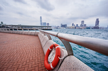 Hong Kong harbour promenade and city view. 