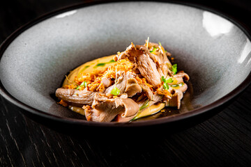 Mashed potatoes with fried oyster mushrooms in bowl
