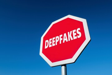 Stop sign with a text DEEPFAKES to cease fake imagery generated by artificial intelligence