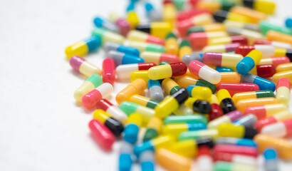 Fototapeta na wymiar colorful capsule pills on white background