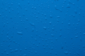 Water drops on blue color  surface