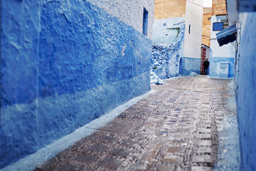 Street in medina of blue town Chefchaouen, Morocco.